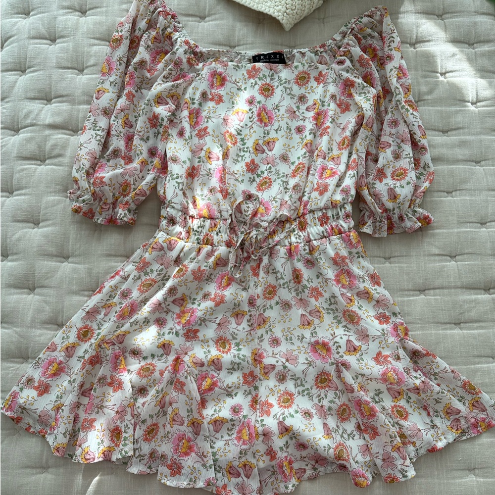 Francesca’s Trixxi floral romper. Light material. Tie detail. Like new. Small.